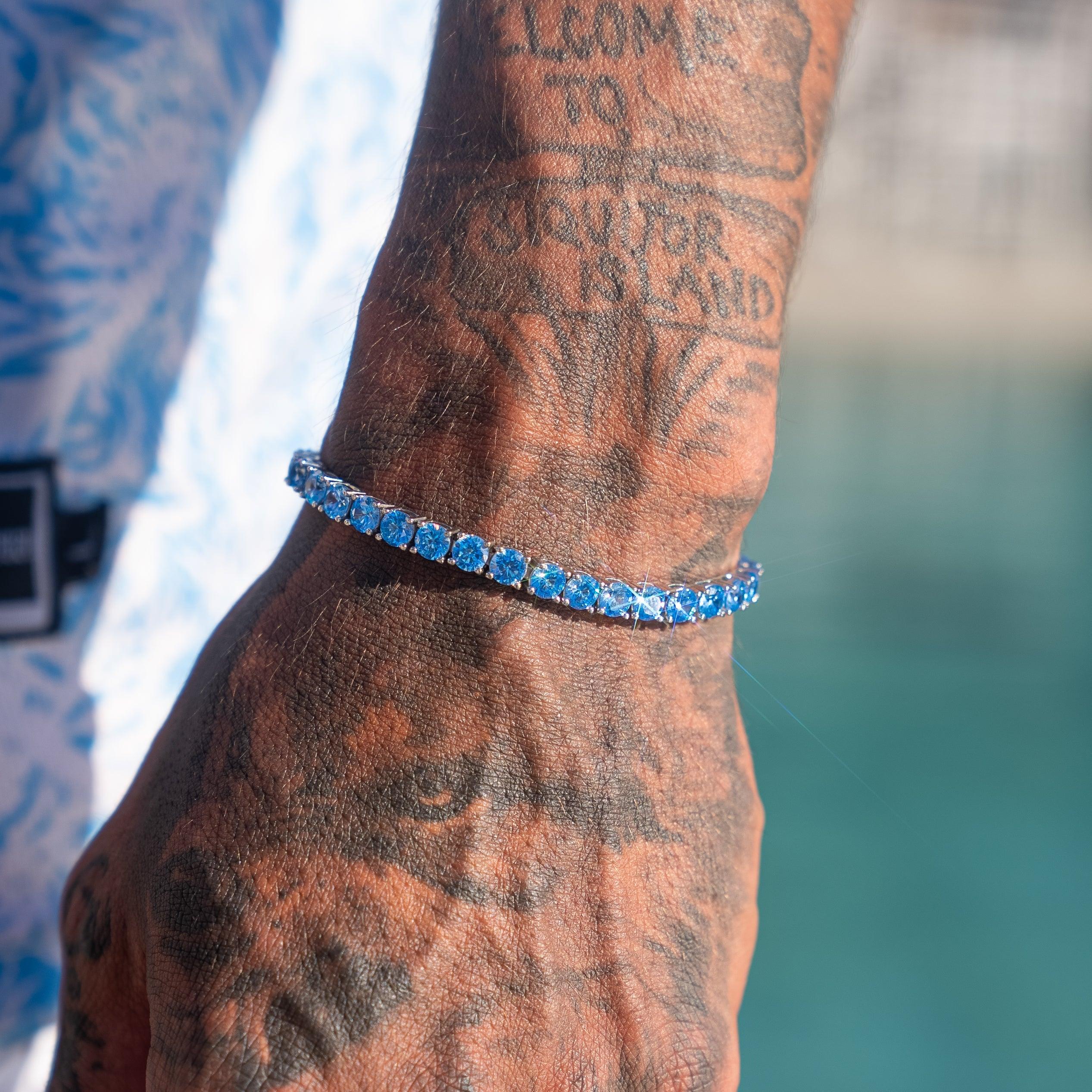 5mm Tennis Bracelet with Blue Sapphire on wrist in sunlight.