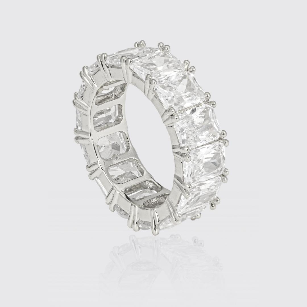 White gold baguette ring with large 4MM stones, PVD plated, offering lifetime warranty.