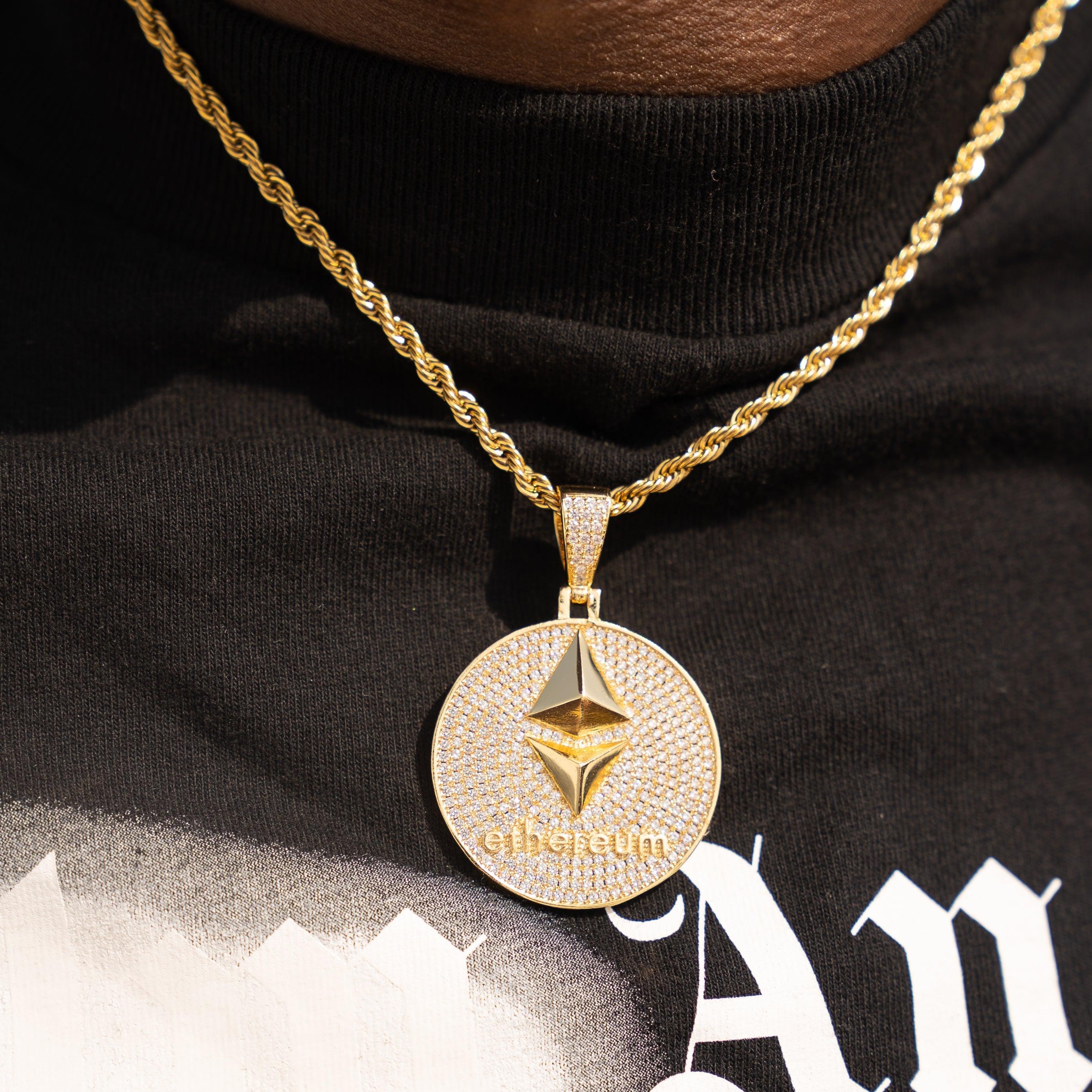 Gold iced Ethereum pendant with flawless VS diamond simulants on chain necklace.