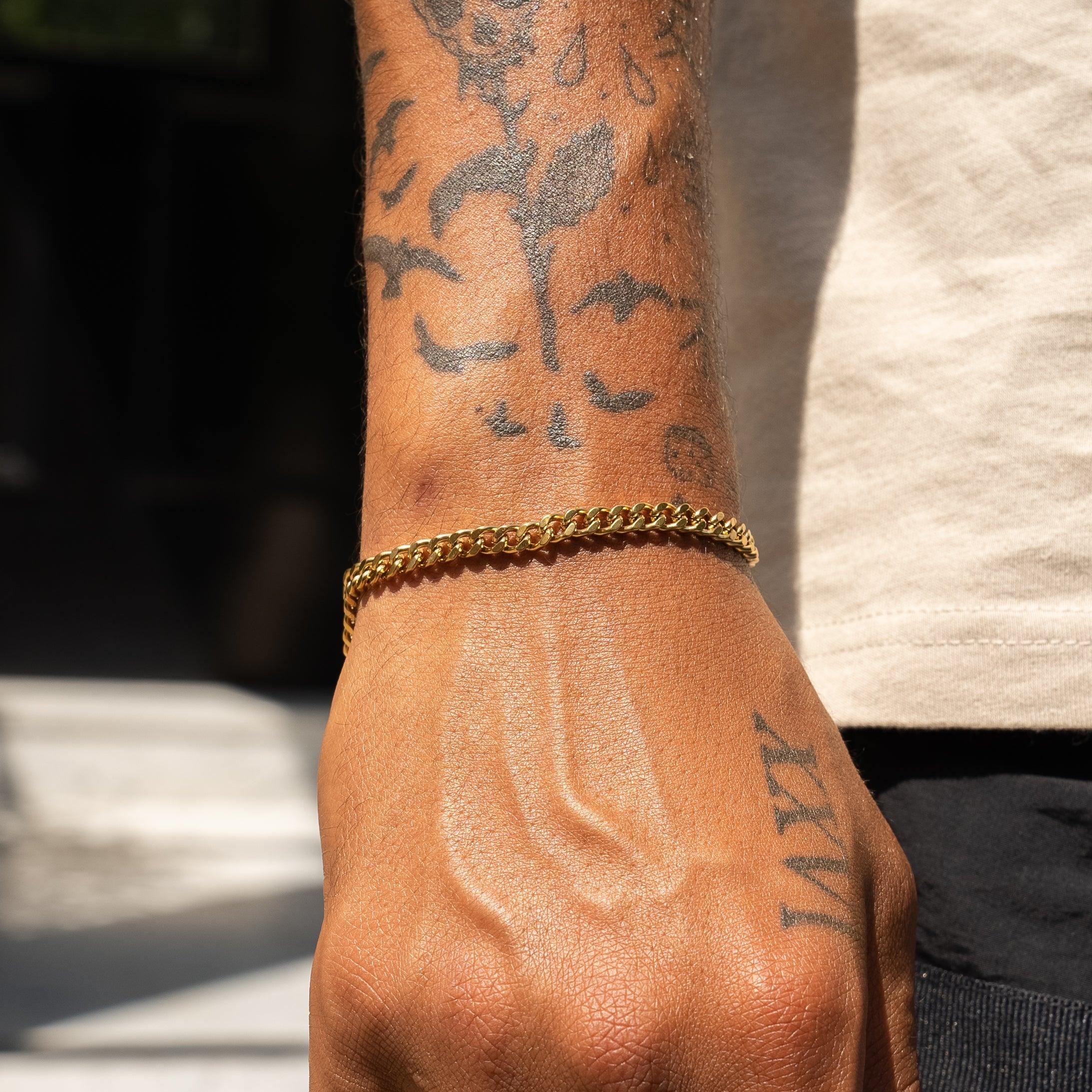Micro Cuban Bracelet in gold on wrist, handcrafted with 316L stainless steel and 18K PVD plating.