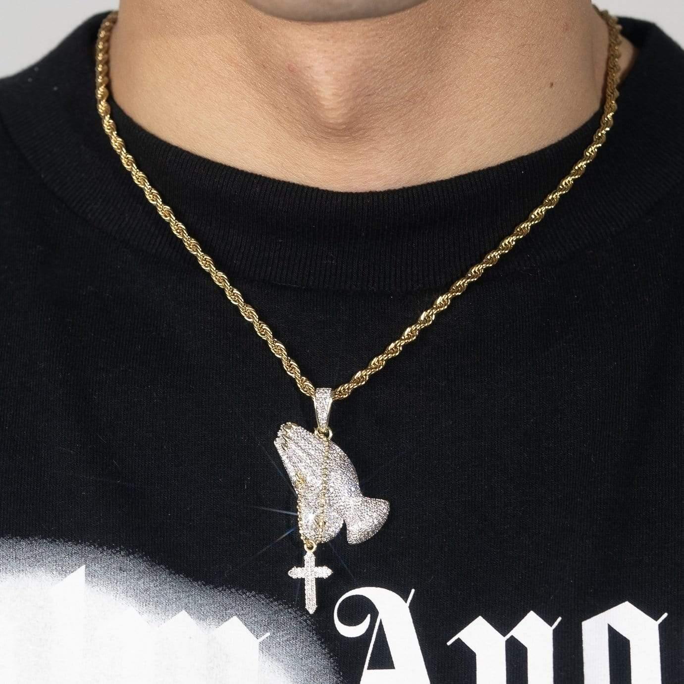 Moissanite iced praying hands pendant with hanging cross on gold twisted chain necklace