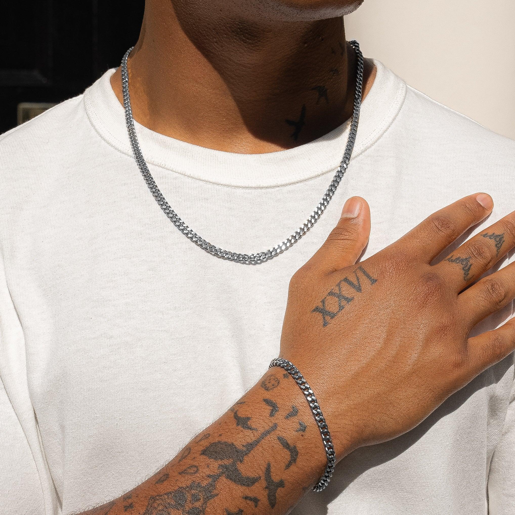 Micro Cuban Chain and Bracelet Set in White Gold worn on wrist and neck.